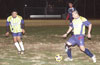 Estuardo Larios of Tuxpan(right) about to dribble by Jonathan Lizano