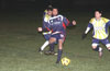 Winson Elegolda of Maidstone(center) passing the ball before Uchupie Esteban of Tuxpan(right) can get it
