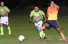 Luis Barrera of Maidstone Market(right) kicking the ball past Reynaldo Yanes of FC Tuxpan