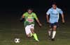 Juan Velazquez of FC Tuxpan protecting the ball from Jon Lizano of Bateman Painting