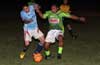 Juan Zuluaga of Batemena Painting(left) and Nettie Sanchez of FC Tuxpan fighting for the ball