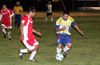 Reynaldo Yanes of FC Tuxpan(right) moving the ball past Juan Olvera of Tortorella Pools