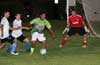 Nettie Sanchez of FC Tuxpan(center) surrounded by Geber Garcia(left), Antonio Padella about to blast the ball past Alex Mesa of Maidstone Market