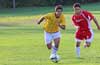 Angel Garces of 75 Main(left) and David Rodriguez of Tortorella Pools racing toward the ball