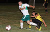 Luis Munoz of FC Tuxpan getting by Romulo Tubatan of Bateman