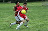 Eddie Lopez(front) of Tortorella Pools protecting the ball from Cesar Bautista of Cuenca FC