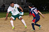 Antonio Padilla of Maidstone Market(right) watching the ball go by Giovany Espinoza of FC Tuxpan