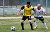 Jonathan Lizano of Bateman Painting(left) holding off Ivan Espinoza of FC Tuxpan