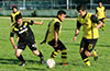 Jaime A Rincon of Bateman(right) going by his team mate Carlos Portillo(center) and Cesar Correa of Hampton FC(left)