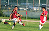David Rodriguez of Tortorella Pools(right) blasting the ball past Cuenca FC forward Cristian Penafiel
