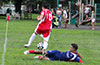 Mathew Ramirez of Maidstone Market sliding to steal the ball from Eddie Lopez of Tortorella Pools