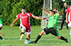 Who will get to the ball first, Daniel Salazar of Tortorella Pools(left) or Cesar Correa of Hampton FC