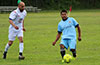 Tono Gonzalez of Hampton FC hitting the ball before Alfredo Negrete of FC Tuxpan can stop it