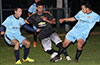 John Romero of Maidstone(center) trying to get by Danny Salazar(left) and Juan Guzman of Hampton FC