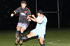 Leonardo Garcia of Maidstone Market jumping over the miss kick by Juan Guzman of Hampton FC