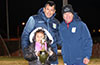 Kimberly Barrera holding the winning trophy in front of Luis Barrera(left) and John Romero of Maidstone Market