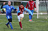 Xavi Piedramartel of Maidstone(right) kicking the ball up the field in front of Rafael Santos of Bateman