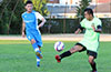 Stiven Orrego of Tortorella Pools(left) kicking the ball past Roberto Meza of FC Tuxpan
