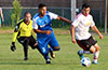 Bateman Painting forward, Jonathan Lizano, trying to dribble by Cristian Munoz and Tortorella goalie, Alejandro Bolanos