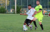 Jose Almansa of Hampton FC(right) holding off Tono Gonzalez of Bateman Painting