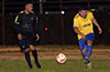 Giovany Espinoza of FC Tuxpan(right) hitting the ball past Jeison Cardozo of Maidstone Market