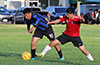 A Southampton FC foward holding off a East Hampton SC defender
