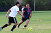 Jonny Bautista of Liga de Gulag about to pass by Cristian Compuzano of FC Tuxpan