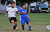 Gustavo Gutama of Liga de Gulag(left) and Edwin Mora racing toward the ball