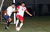 Elvis Rojas of Southampton FC(right) protecting the ball from Jonny Bautista of Liga de Gulag