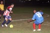 Alejandro Landeros of Tuxpan(left) taking on Walter Arias of Maidstone(right)