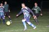 Alejandro Landeros of Tuxpan(center) looking for a open man while Ken Pascual of Bayberry(right) running after him