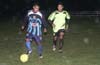 Juan Olvera of Tuxpan(left) just too fast for John Romero of Rottweilers(right)