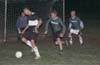 Duvan Castro of Maidstone preparing to take the shot but Chris Bottari(center) and Jeff Esposito plan to block him