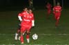 Hector Quintero of Tuxpan protecting the ball from Cesar Bautista of Bayberry