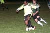 Mark Hogg of the Rottweilers a bit too fast for Adam Lancashire of Bayberry