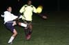 Manuel Lizano of Bateman(left) clearing the ball from Winston Reid of the Rottweilers(right)