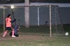 David Cardona of Maidstone(standing) and Leonardo Garcia(ground) of Tortorella watch the ball go out of danger