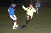 Daniel Munoz of the Rottweilers(right) just missed taking the ball away from a Tuxpan defender