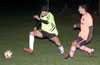 Albeiro Betancur of the Rottweilers(left) getting by Antonio Padilla of Maidstone