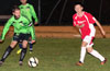 Jose Almonsa of Hampton FC about to take on Esteban Uchupaillie of Tortorella Pools