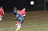 Nettie Sanchez of Bateman Painting(left) and Daniel Salazar of Tortorella Pools racing toward the ball