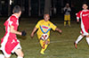 Ivan Espinoza of FC Tuxpan being watched by Stiven Orrego of Tortorella(left) and Esteban Uchupaille