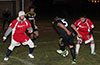 Tono Gonzales of Hampton FC(#5) trying to dribble past Daniel Londono and Cristian Munoz(right) of Tortorella