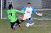 Olger Araya, The Hideaway keeper, coming out to block the shot taken by Oscar Reinoso of Hampton FC