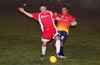 Stiven Orrego of Tortorella Pools(front) protecting the ball from Santiago Guerrero of FC Tuxpan