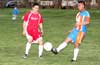 Edvardo Robles of The Hideaway(right) trapping the ball in front of Stiven Orrego of Tortorella Pools