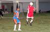 Rodolfo Marin of Tortorella Pools heading the ball out of danger in front of Cesar Galeas of The Hideaway
