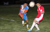 Christian Bautista of The Hideaway(left) blasting the ball past the head of Cristian Duran of Tortorella Pools
