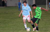Andres Zuluanga of Bateman Painting(left) about to block a shot taken by a Hampton FC forward
