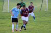 Esteban Uchupaille of Bateman Painting protecting the ball from Mathew Ramirez of Maidstone Market